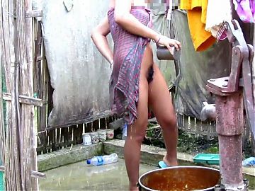 Indian village girl washing